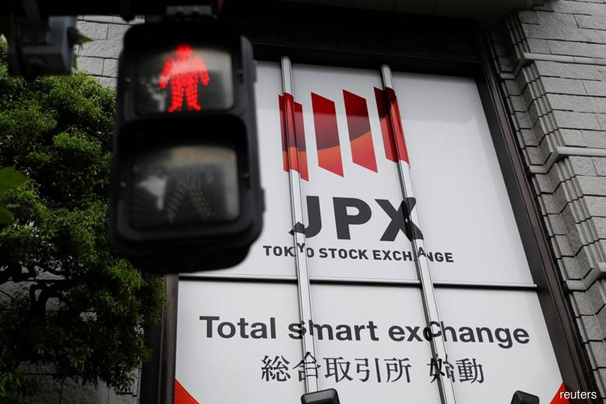 Japanese shares edge up as utility stocks jump